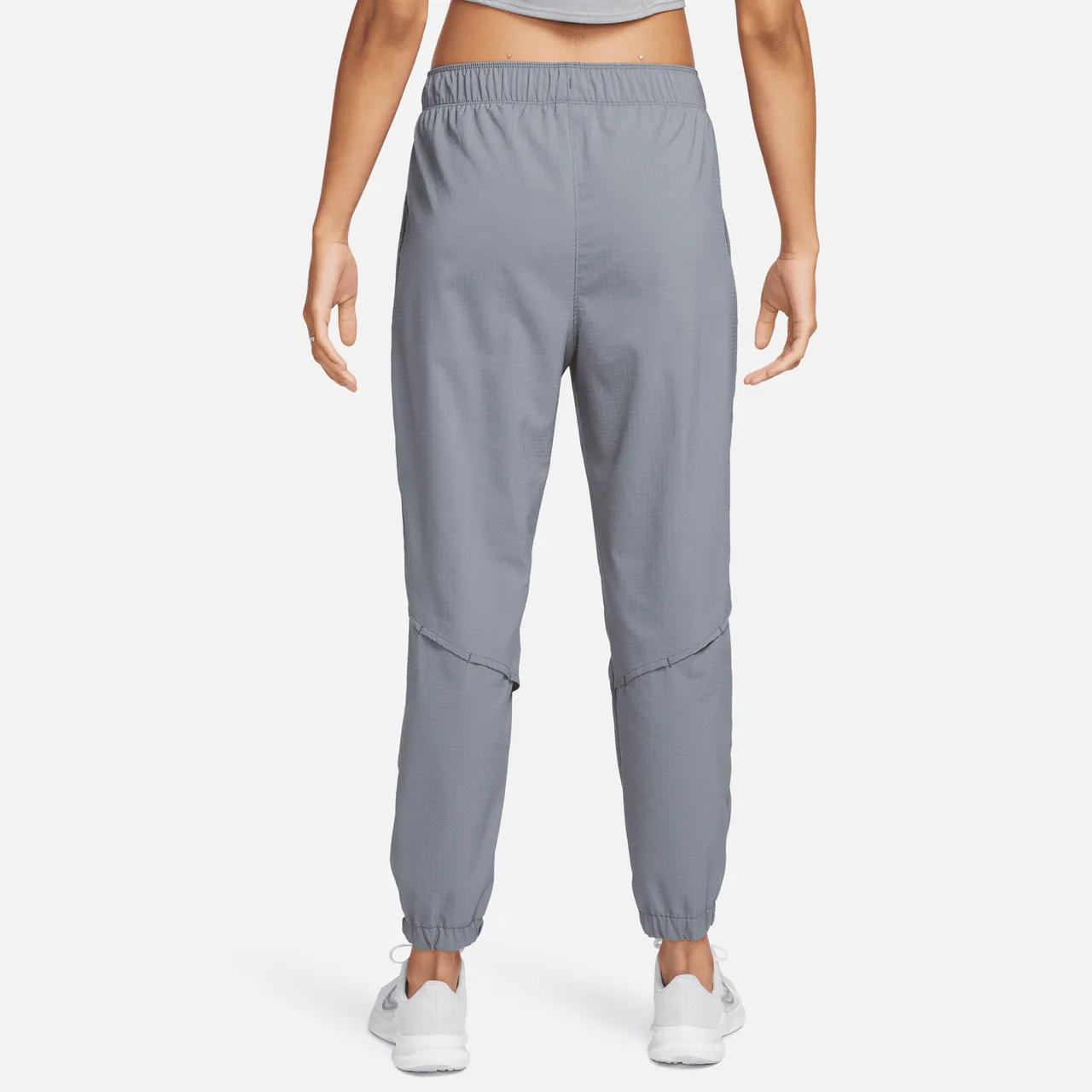 Nike Dri-FIT Fast 7/8-hardloopbroek met halfhoge taille voor warming-up voor dames - Grijs