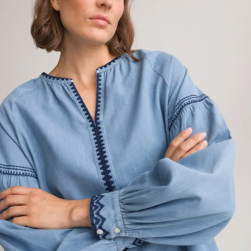 Soepele blouse in denim met tuniekhals en borduursels